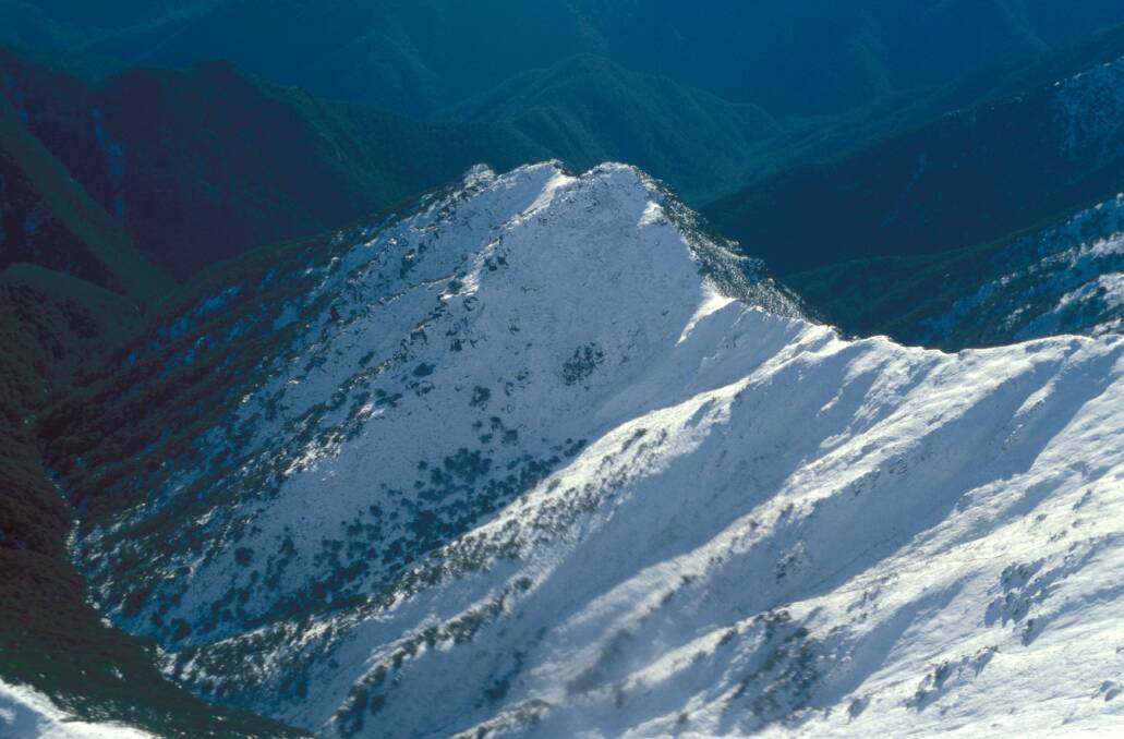A 1974 aerial view of Watsons Crags, part of the Main Range of the Snowy Mountains. Picture: Graeme L Worboys