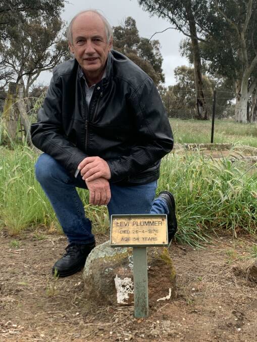 Peter Browning at the grave of his great-great-grandfather Levi Plummer. Picture: Tim the Yowie Man