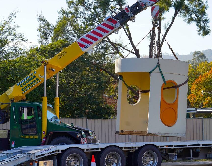 A Cummings' bus shelter is removed from Atkins St, Kambah. Picture: Thomas Schulze