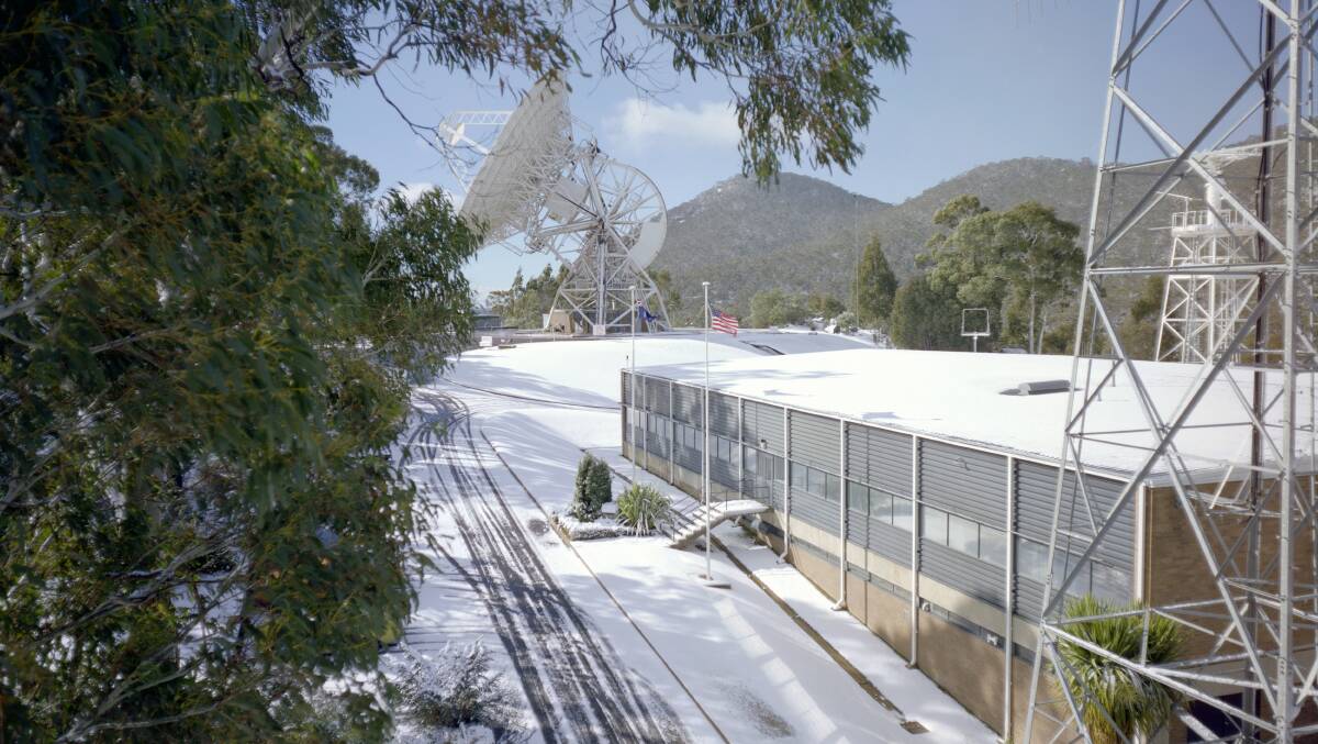 Snow often made it difficult to reach the Honeysuckle Creek Tracking Station via the old Apollo Road. Even in summer, snow was possible - this photo was taken on Christmas Day, 1968. Picture by Hamish Lindsay and Colin Mackellar