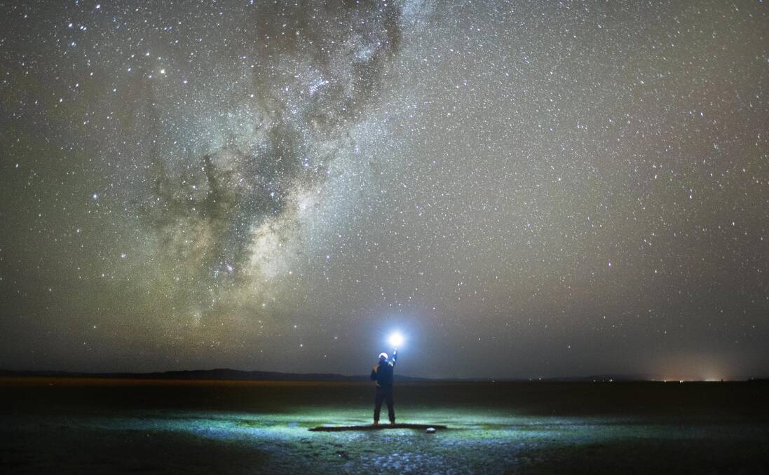 Peter Reichstein under The Milky Way on a dry Lake George, prior to this week's rain. Picture: 50Eight Photograph