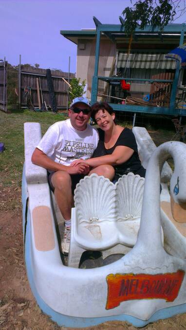 Michelle Ayers and partner Ray Murrell on a salvaged swan. Picture: Supplied