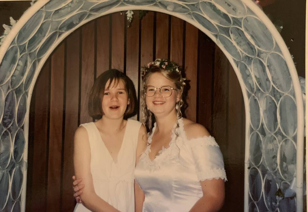 The photo that started it all: me (right) at my debutante ball in 1993 with my younger sister Holly.