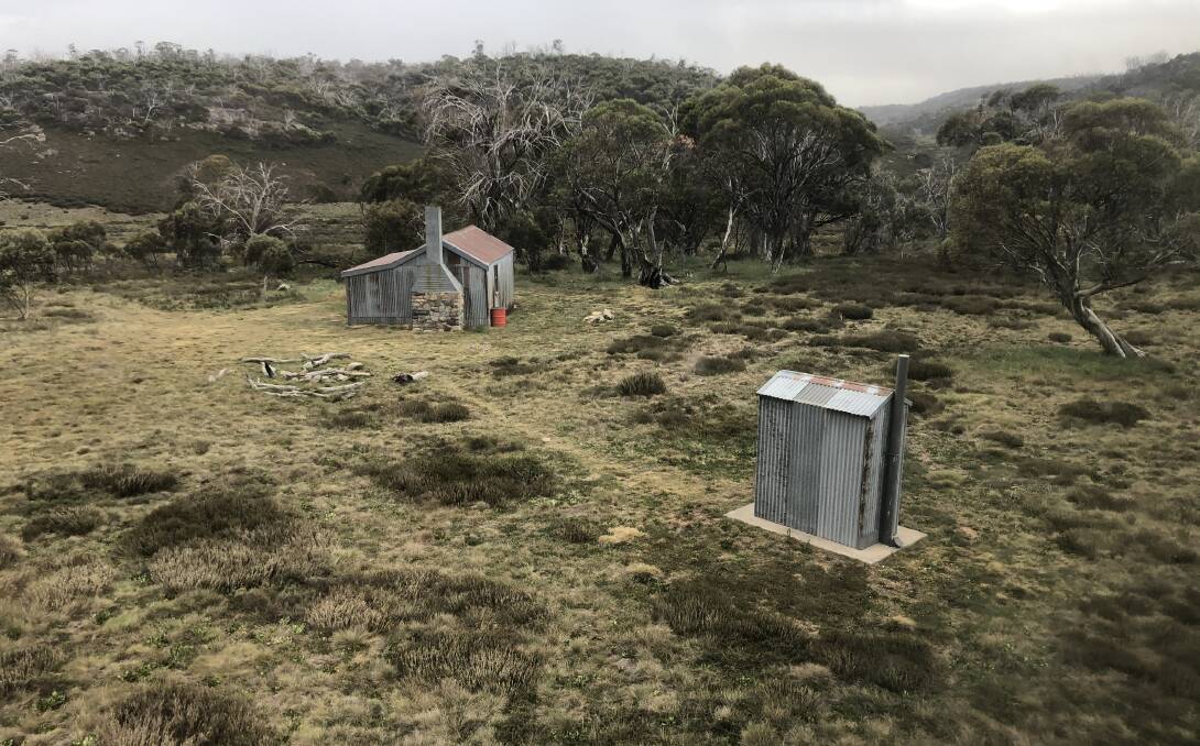 Mackeys Hut and outhouse hastily snapped from the departing helicopter. Picture: Anthony Sharwood