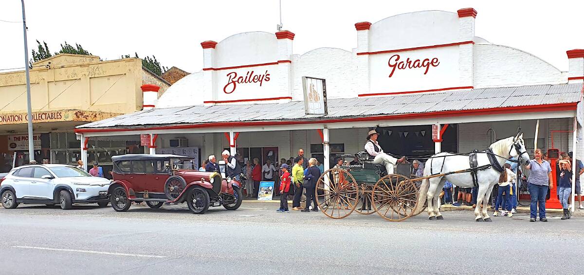 Three modes of transport from three different centuries line up outside Bailey's Garage, Gunning. Picture: John Storey