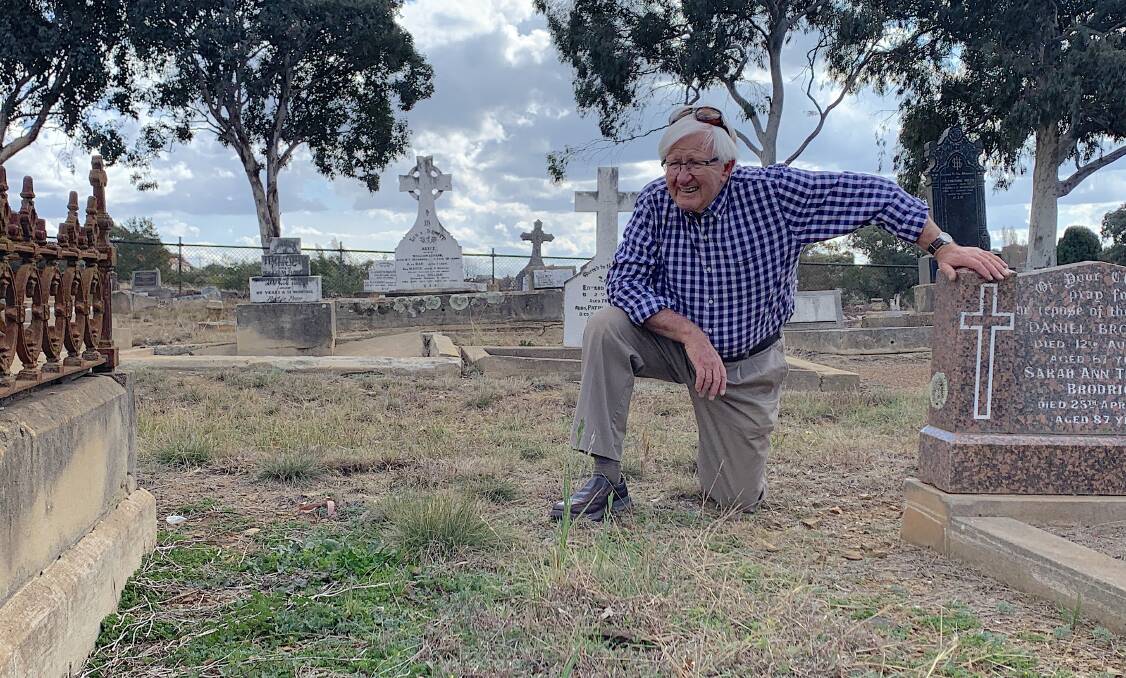 Richard Lamb at Philip Mackenzie Pitt's unmarked grave at the Queanbeyan Riverside Cemetery. Picture: Tim the Yowie Man