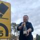 Gary Poile with one of hundreds of bottles of bubbly salvaged by local farmers after a 1983 crash on the Cullarin Range between Breadalbane and Gunning. Picture: Tim the Yowie Man