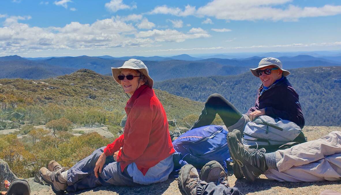 NPA ACT members Jan and Phillip enjoy the extensive vista atop Mt Gudgenby in the heart of Namadgi National Park before the fires in October last year. Much of this area is now burnt. Picture: Cynthia Burton