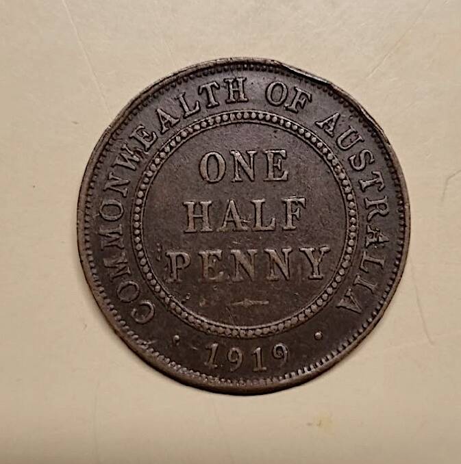 A 1919 half-penny, one of several coins Graeme found while restoring The Rising Sun. Picture by Graeme Rossiter
