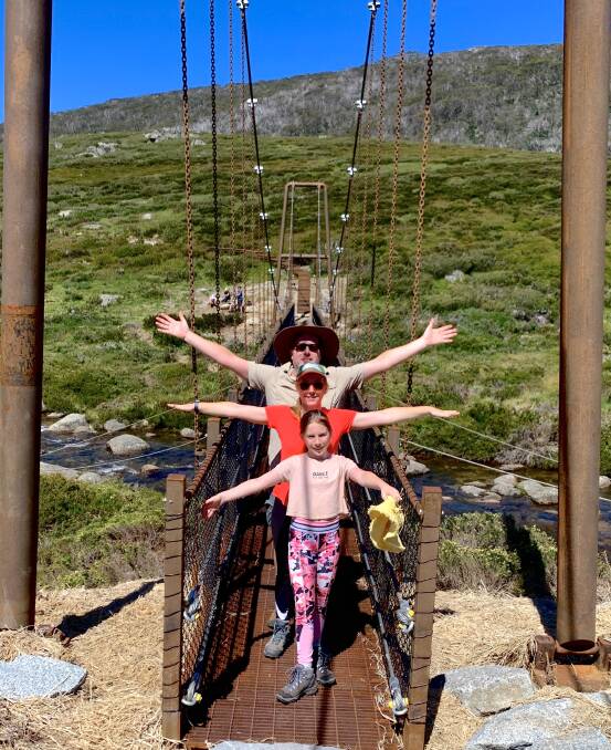 Tim and his daughters check out the new suspension bridge at Spencer Creek near Illawong Lodge. Picture: Tim the Yowie Man