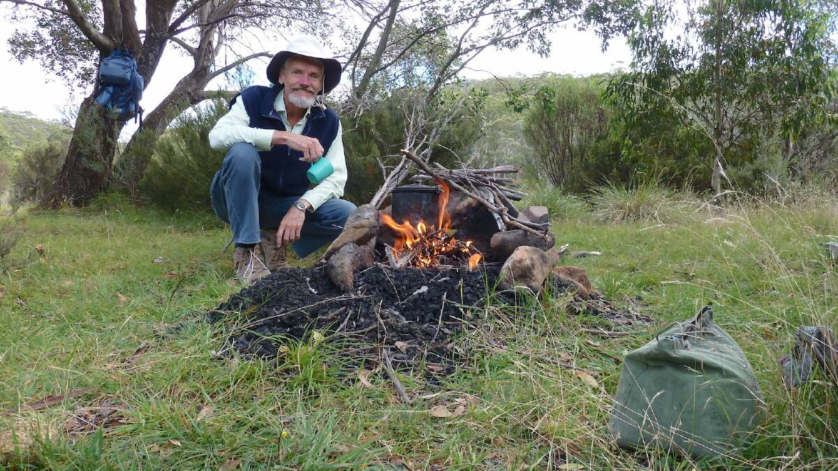 Matthew Higgins boils the billy at his 'secret' camp on the Eucumbene River. Picture: Matthew Higgins