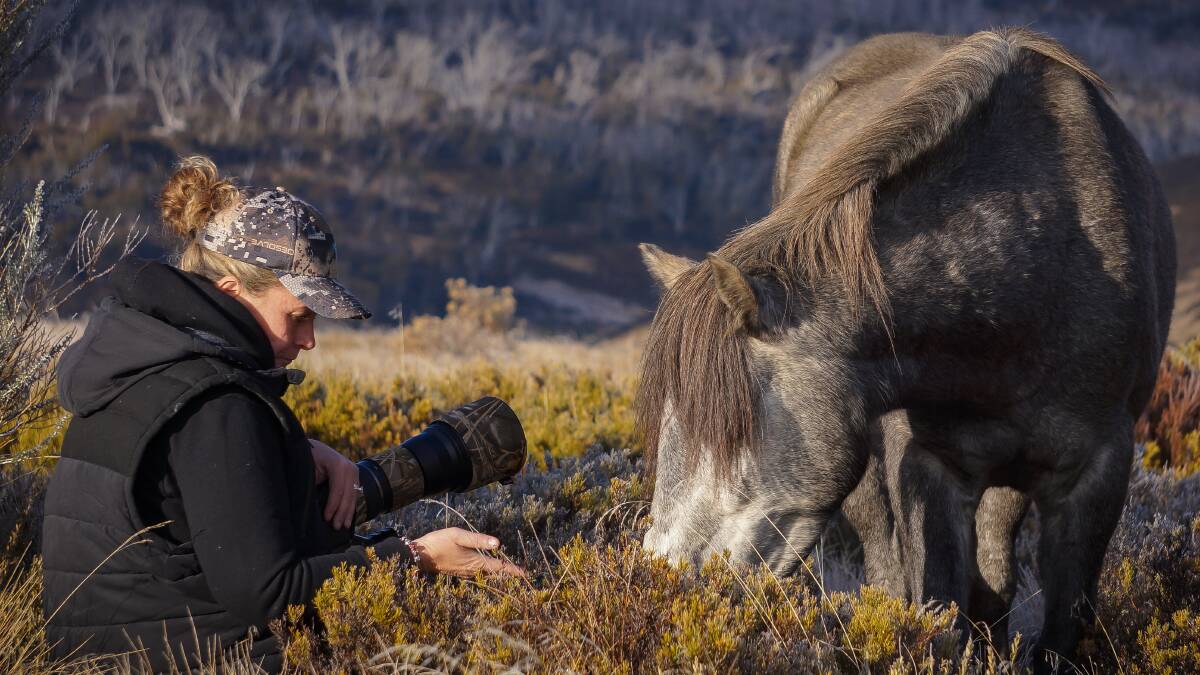 Photographer Michelle Brown in the field. Picture: Ian Brown