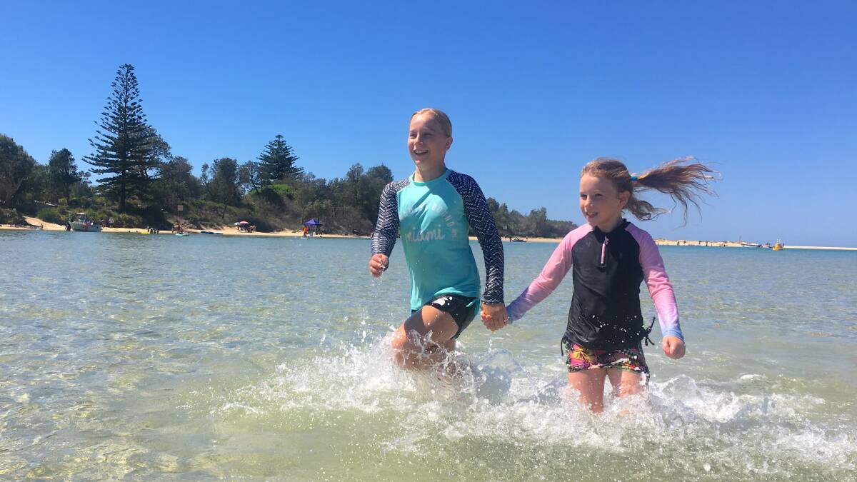 Sarah and Emily run hand-in-hand along the NSW/ Jervis Bay Territory border. Picture: Tim the Yowie Man
