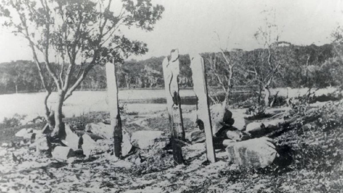 The original grave site and remains of the timber monument, circa 1920. Picture supplied