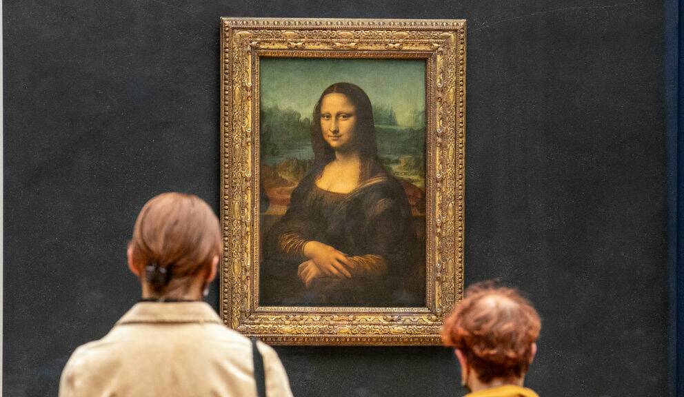 Crowds observe the 'real' Mona Lisa at the Louvre, Paris. Picture: Shutterstock