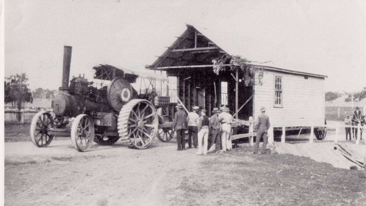 The Gribble steam engine crosses the Hall bridge hauling the Ginninderra Farmers' Union building enroute to Hall Showground, 1930. Picture: Hall School Museum & Heritage Centre