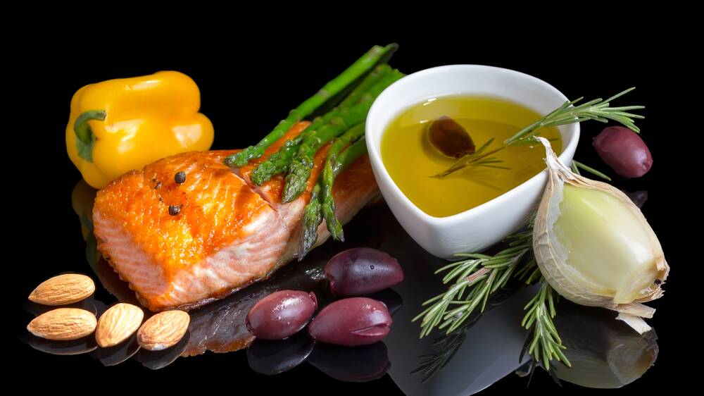The Mediterranean diet is also about eating together, sharing produce, food preparation and enjoying company. Picture: Shutterstock