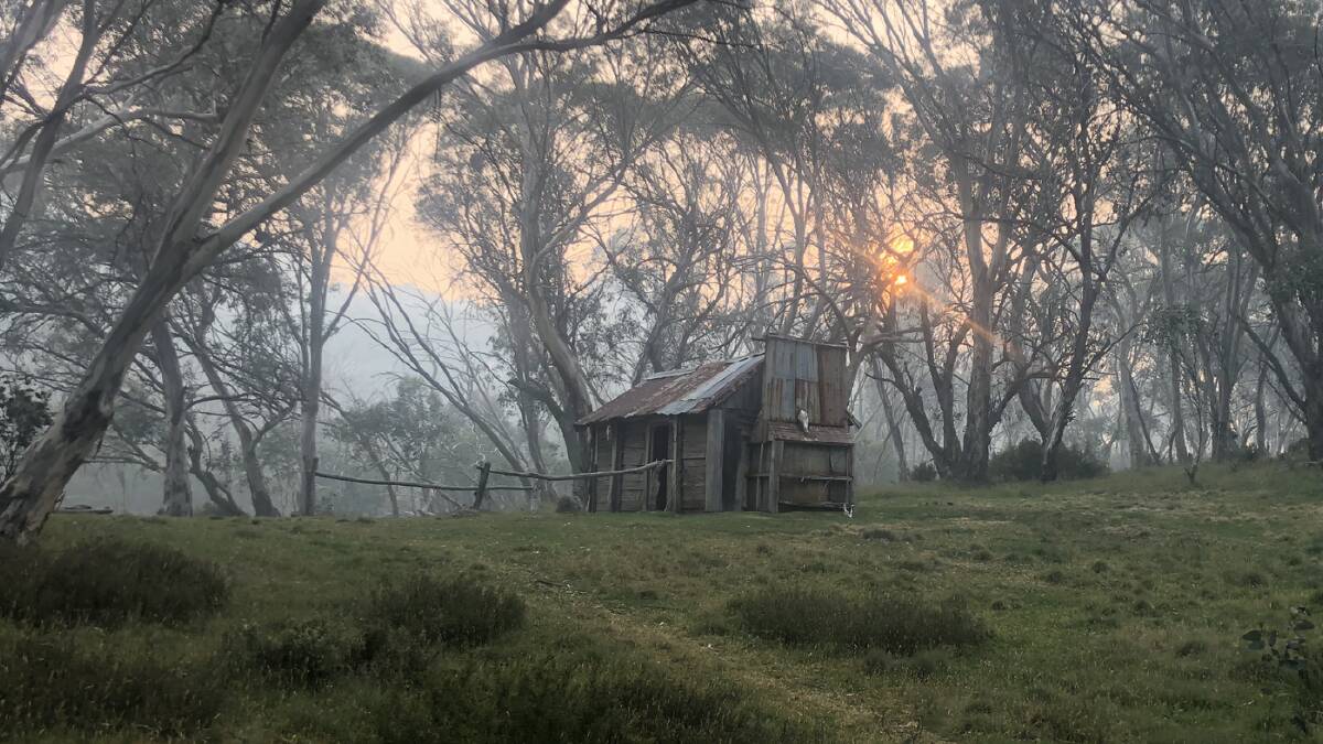 Bushfire smoke results in an orange sunset at Cascade Hut. Picture: Anthony Sharwood