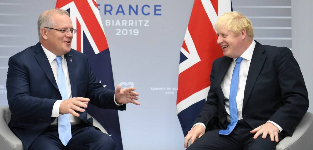 Scott Morrison and Boris Johnson share a joke at the G7 meeting in France. Picture: Getty Images