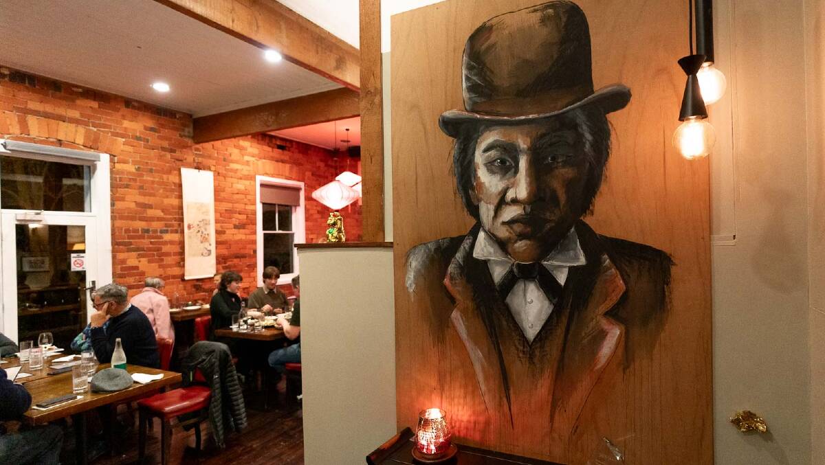 A portrait of the Chinese detective Fook Shing greets diners at a restaurant
named in his honour. Picture by Michael Turtle