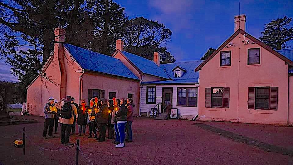 A tour group recreates the midnight candlelight funeral procession for Jane Cynthia Cunningham. Picture: Andrew Sikorski/ACT Historic Places