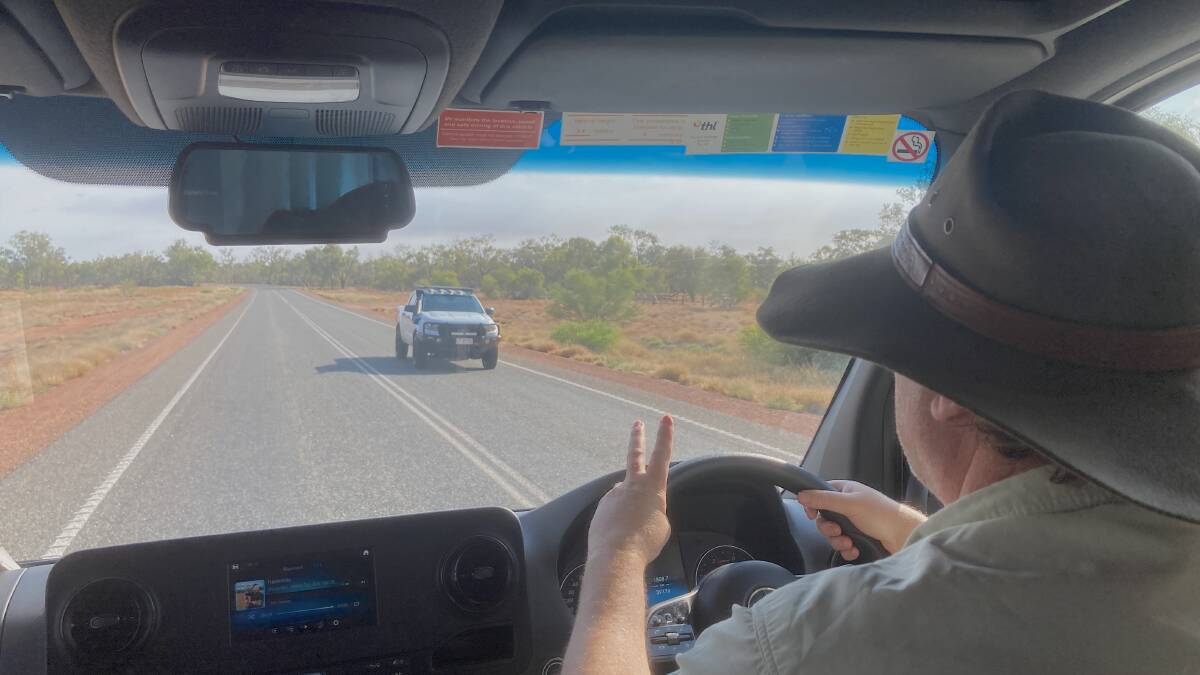 Tim tries the two-fingered desert wave on a passing motorist with no success. Picture supplied