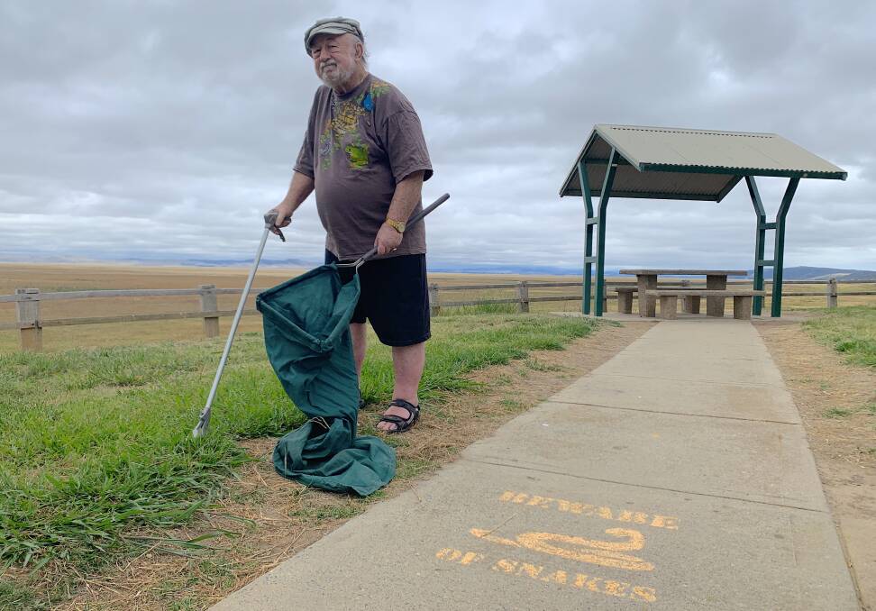 Longtime snake catcher Ric Longmore at a Federal Highway rest area where tiger snakes were once spotted regularly. Note: When actually collecting snakes Ric advises to always wear closed footwear for safety reasons!
Picture: Tim the Yowie Man