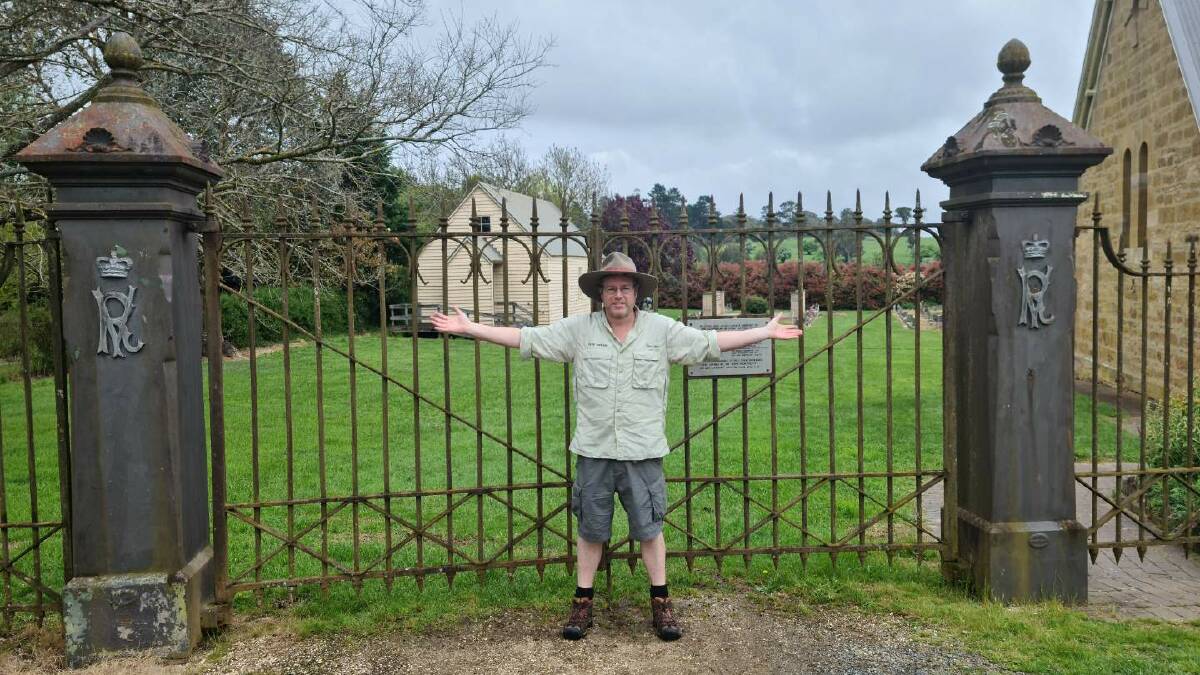 Tim at Hillview's former gates, re-erected at Sutton Forest Anglican Church in 1958. Picture by Dave Moore