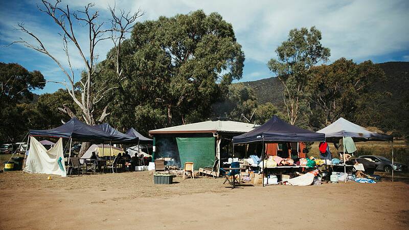 Some of the protesters gathered at Caloola Farm, near Tharwa. Picture Dion Georgopoulos