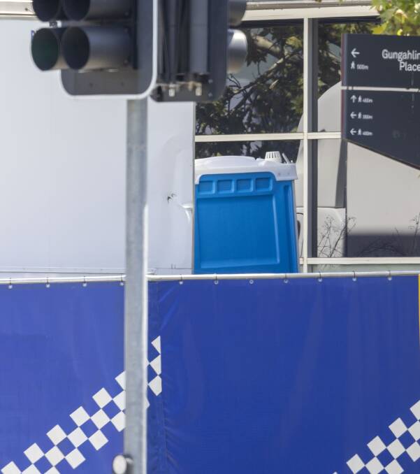 Officers had to perform their ablutions in a portaloo behind temporary crime scene barriers. Picture by Gary Ramage