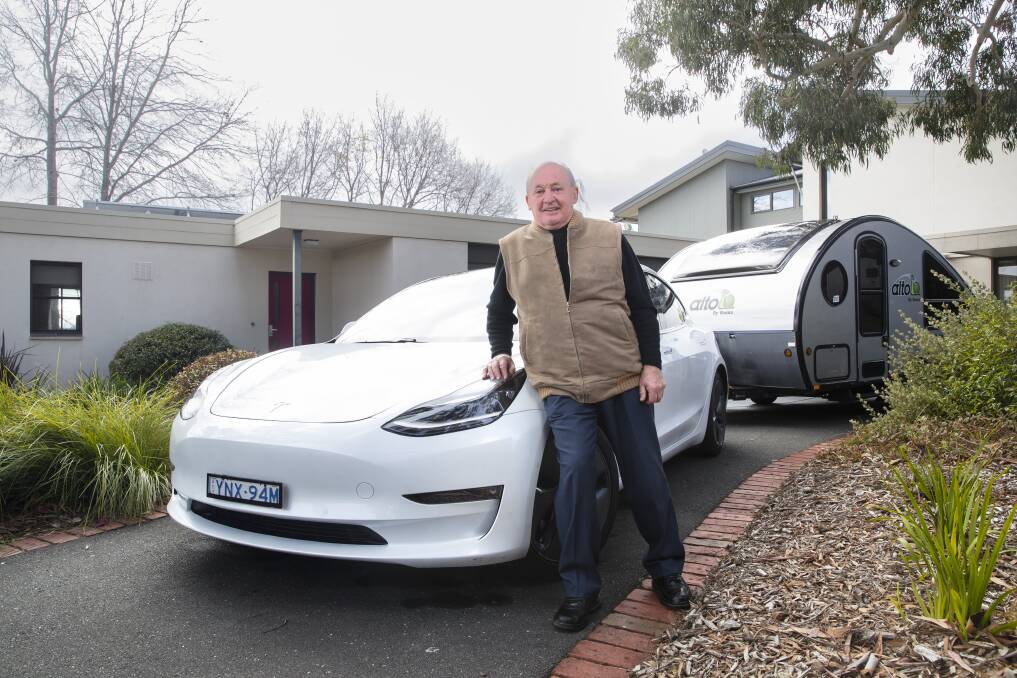 Canberra's Keith Blackburn uses his Tesla to tow his van down to the South Coast. Picture by Keegan Carroll
