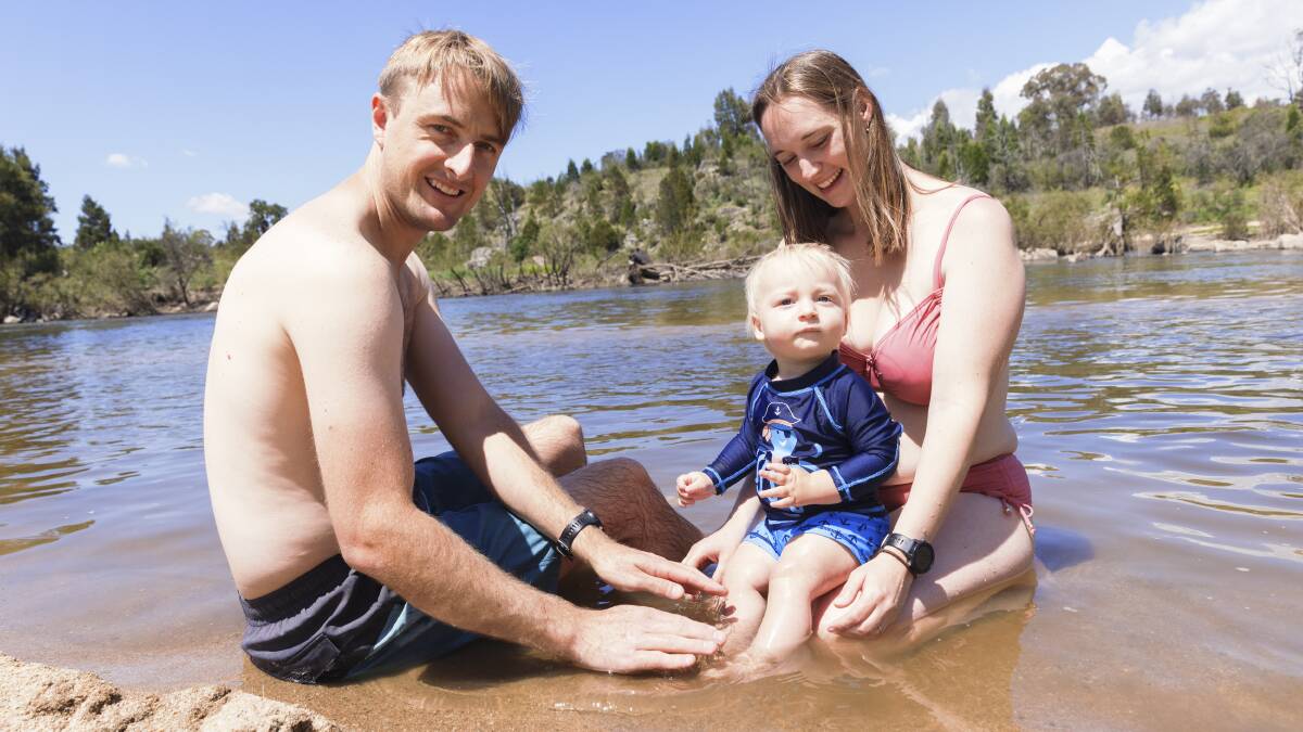 After the heavy rainfall flushed out Canberra's waterways and warm weather arrived, Nick O'Shea, Tanja Binder and one-year-old Jakob O'Shea took the opportunity to spend a few hours by the water at Pine Island in Canberra's south. Picture by Keegan Carroll