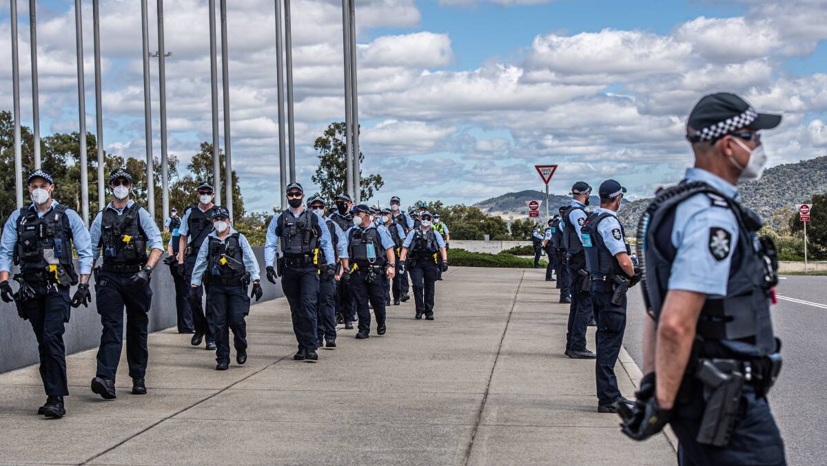 Police form up outside Parliament House. Picture: Karleen Minney