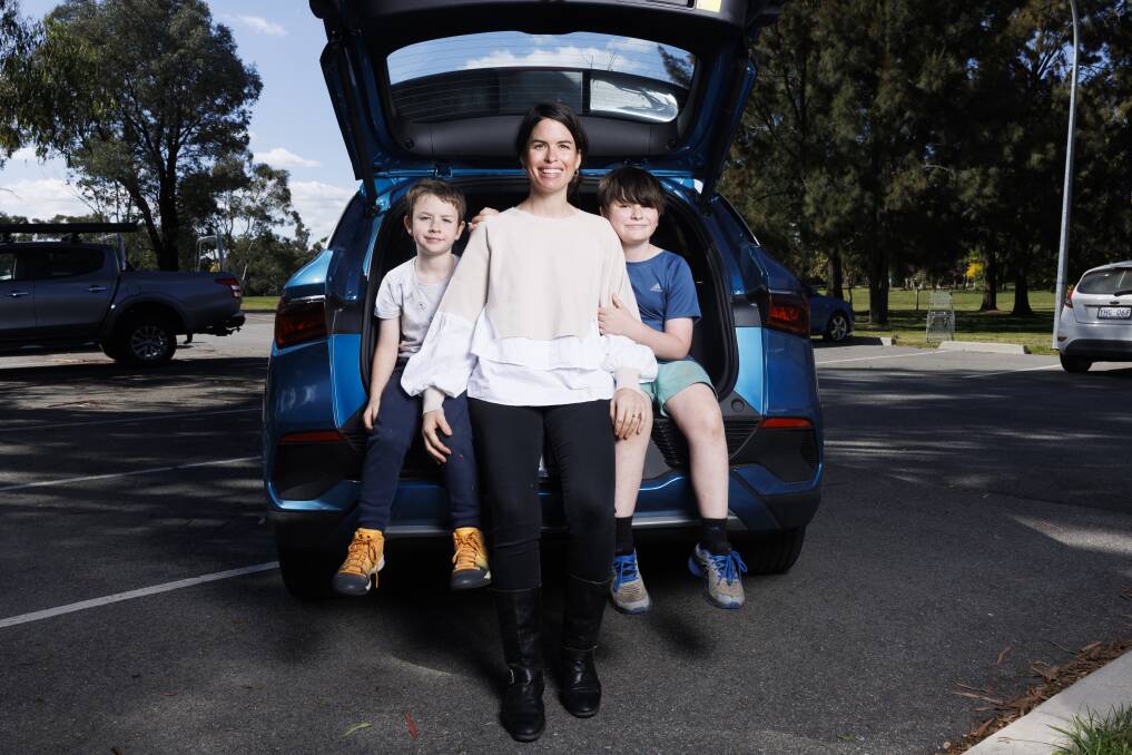 Cate Cool, with sons Noah, 6, and Levi, 9, and the family's new BYD electric car. Picture By Keegan Carroll