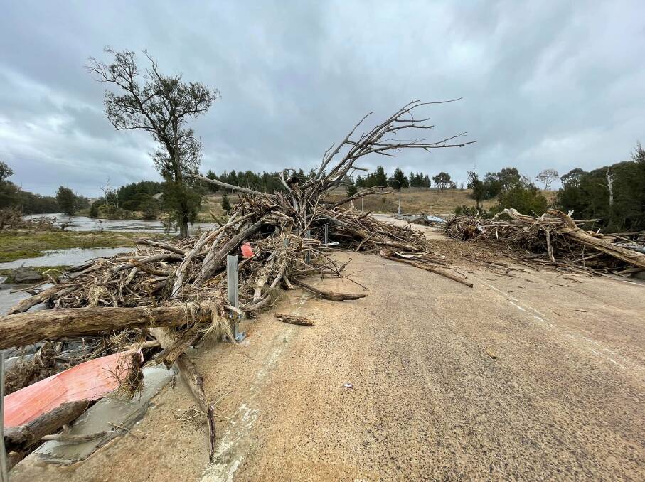 The debris strewn across Coppins Crossing. A vehicle path through it reveals how people have ignored the warning signs and driven through. Picture: Social media