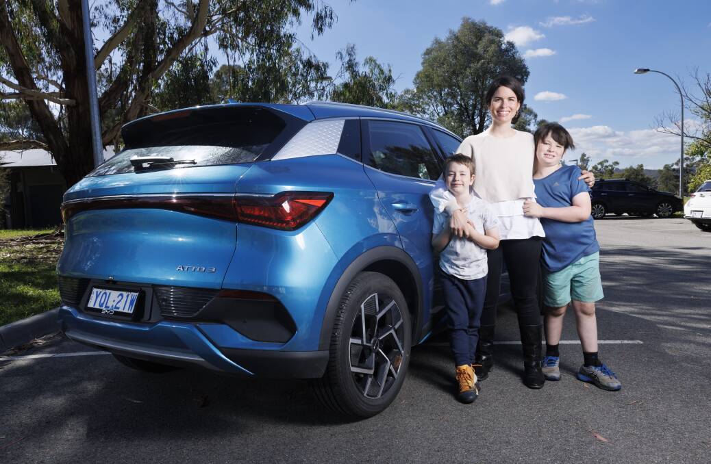 Cate Cool with her Atto 3 electric car, and sons Noah and Levi. Picture by Keegan Carroll