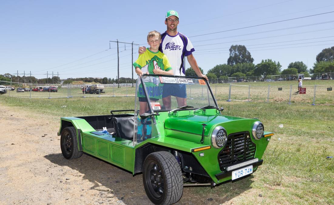Summernats driving champion Keith Miller with his son, Reece, and the Mini Moke. Picture by Sitthixay Ditthavong