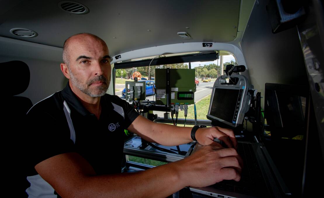 Camera operator Tony Taseski inside the van, monitoring speeds on Jerrabomberra Avenue, Narrabundah. Picture: Elesa Kurtz 