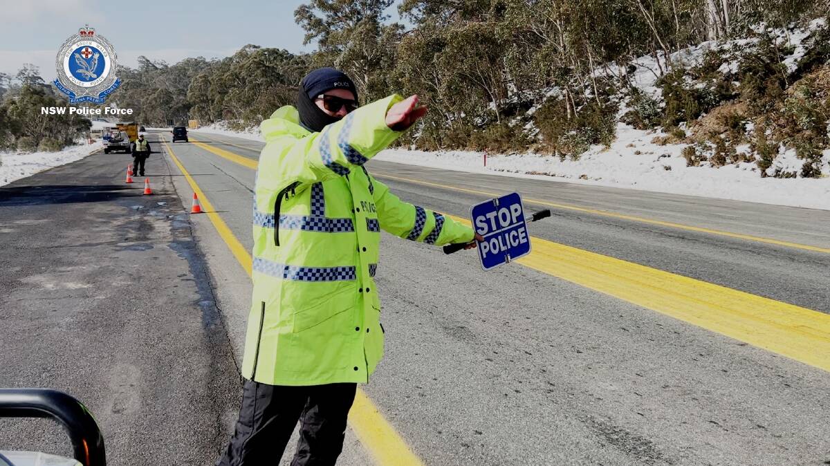 Police stopping and breath-testing motorists on the Kosciuszko Road on Friday. picture: NSW Police