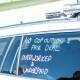 Industrial slogans on a police traffic car. Picture by Karleen Minney