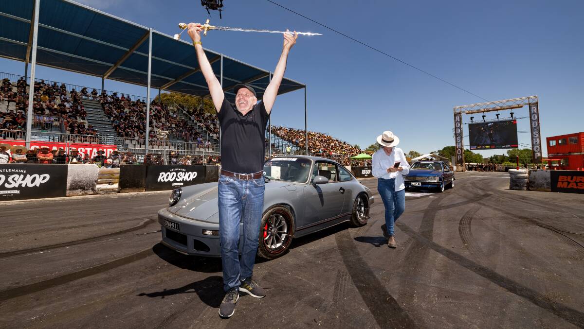 Canberra's Livi Kevantin, with the Real Steel Porsche which won the coveted 2023 Summernats grand champion sword, awarded to the best-in-show vehicle. Picture by Sittihixay Ditthavong