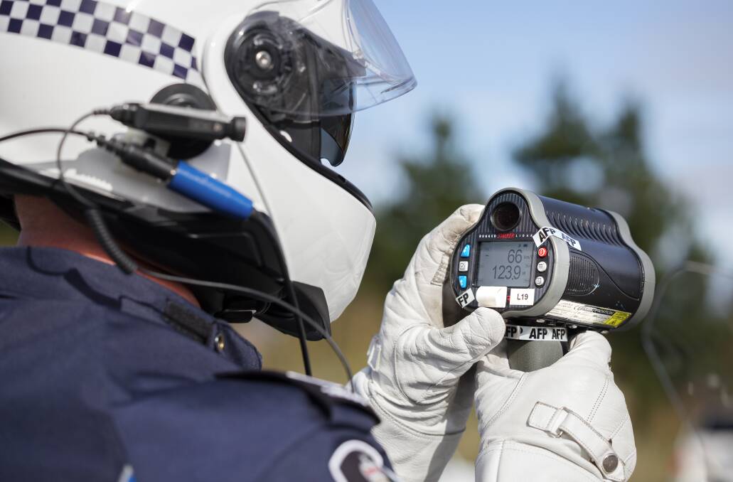 A police motorcyclist using a handheld radar. Picture: Elesa Kurtz
