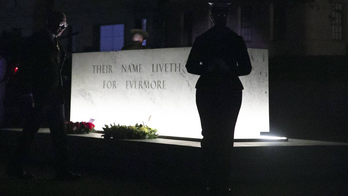 Wreaths are laid at the relocated Stone of Remembrance in Canberra during the Dawn Service. Picture: Keegan Carroll