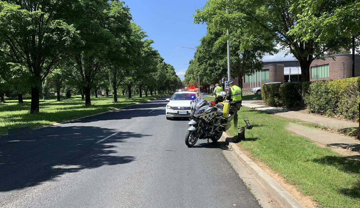 Police breath-testing motorists on Belconnen Way, with a typical roadside screening now taking less than 30 seconds. Picture: Peter Brewer 
