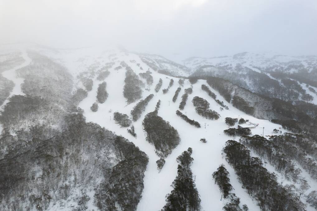 A drone shot of the empty, beckoning snow-covered Thredbo runs ahead of the opening weekend ahead. Picture: Thredbo 