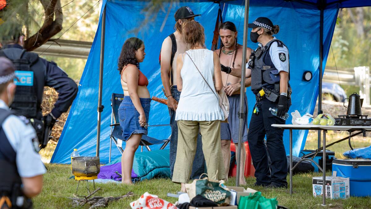 Police explain the campground requirements at the Cotter on Monday. Picture: Sitthixay Ditthavong