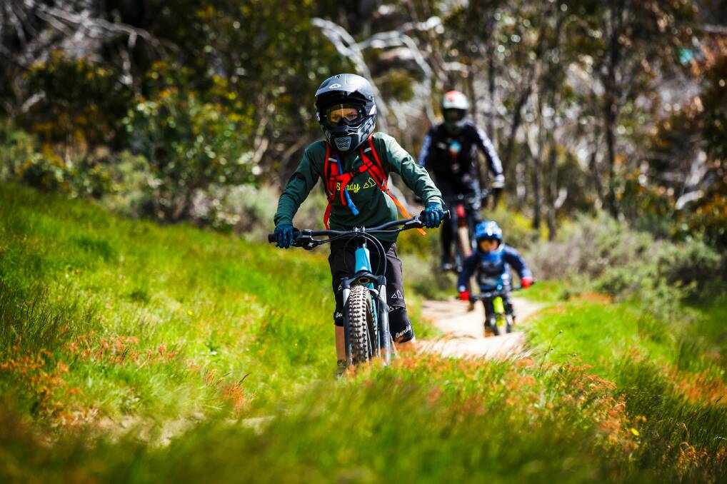 A family mountain-biking in the Thredbo Valley. Picture: Thredbo