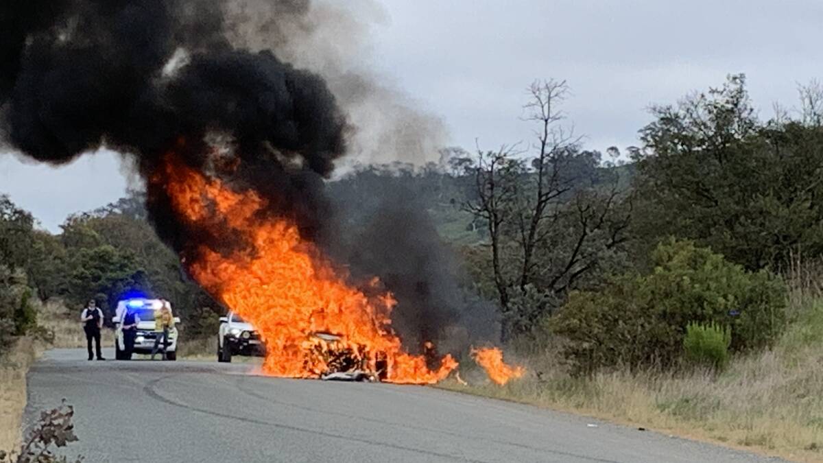 A stolen Mercedes set on fire by car thieves just over the border in NSW. Picture by Peter Brewer