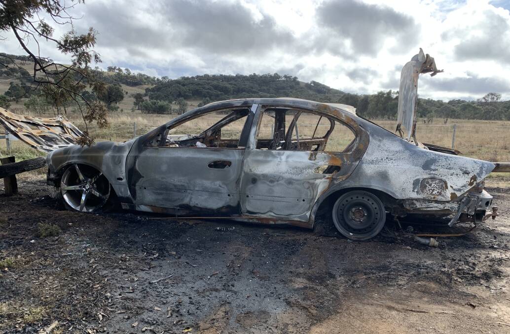 To destroy evidence, thieves will burn a stolen car, as in the case of this Falcon at Mulligan's Flat. Picture: Peter Brewer