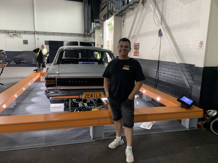 Last year's Summernats grand champion James Mansweto brings an elaborate presentation railing for his show car with four TV monitors showing how the Ford was built. Picture by Peter Brewer 